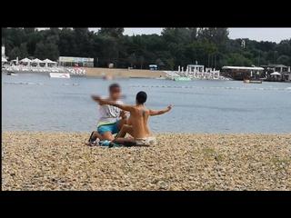 Milf Lilly naked on public beach got oil massage from stranger