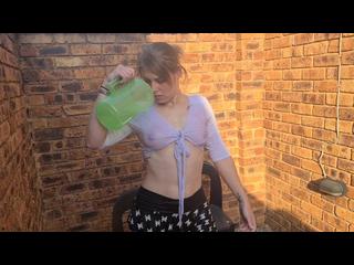 Slut in cotton crop top and skirt, wetting her shirt, playing with her boobs outside in the garden